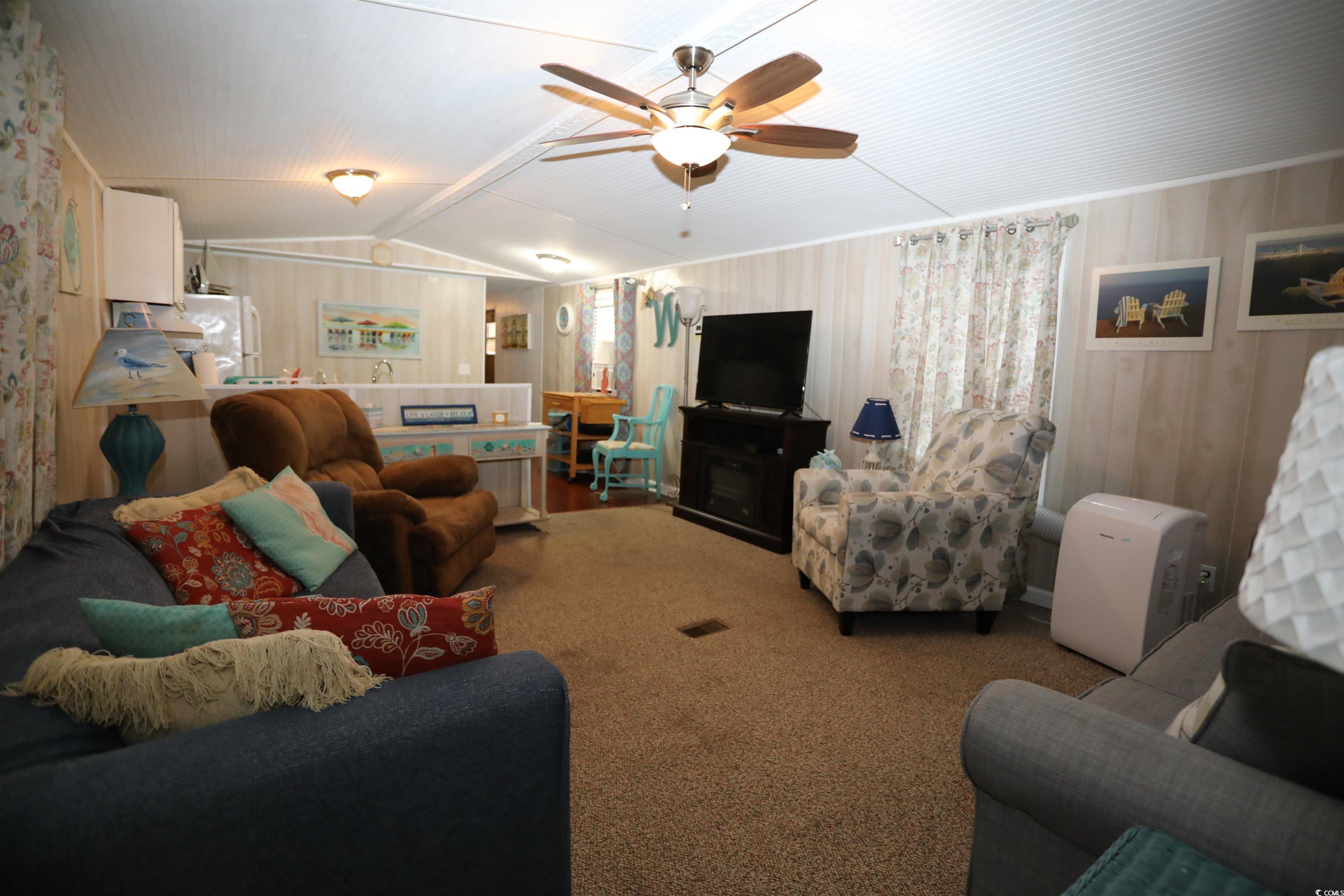 724 1st Street Murrells Inlet, SC 29576 - Photo 13 of 18 Full bathroom with vanity, shower / bath combo with shower curtain, and tile patterned floors