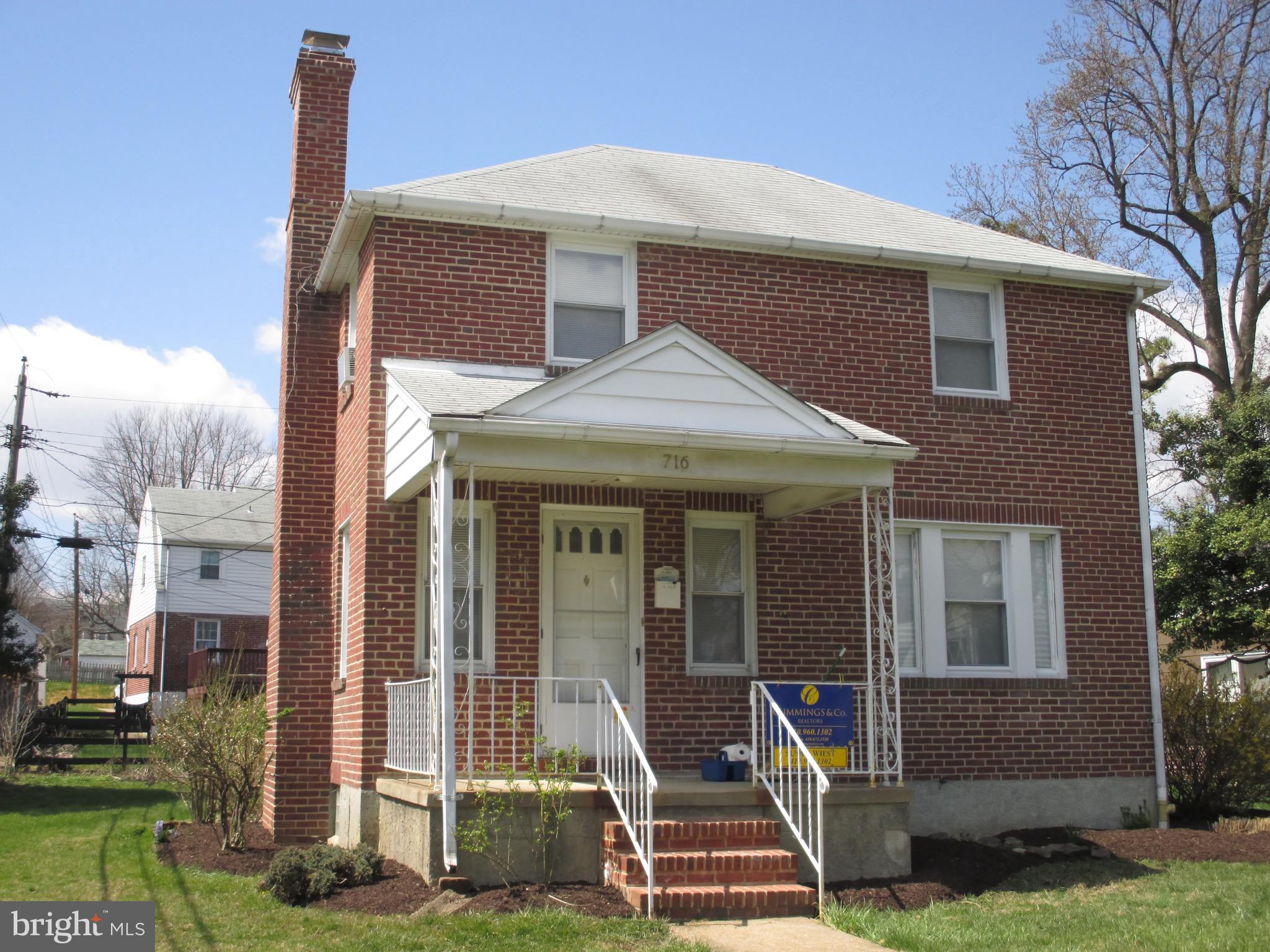 716 Dorchester Road Baltimore, MD 21229 - Photo 1 of 20 a front view of a house with garden