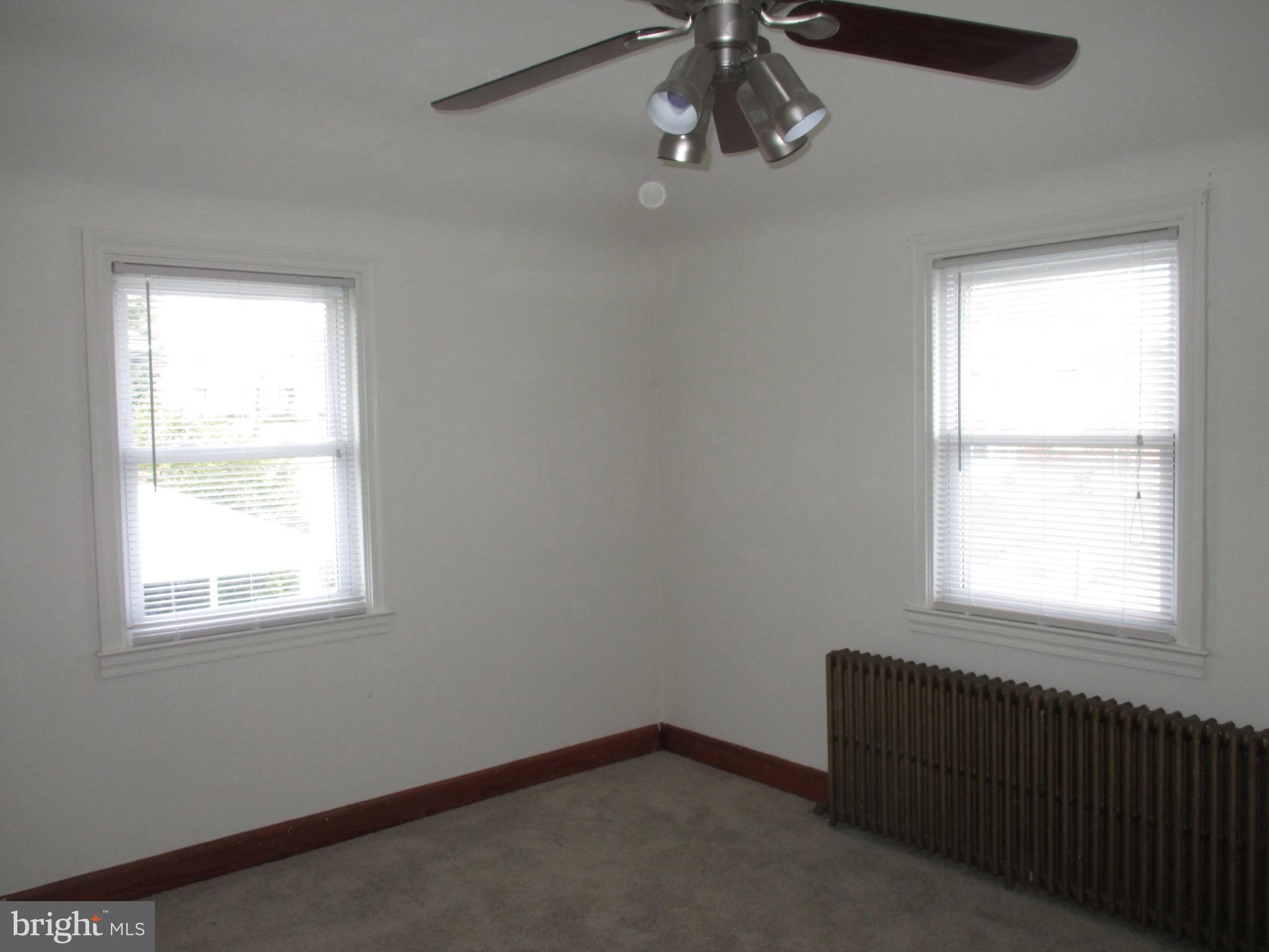 716 Dorchester Road Baltimore, MD 21229 - Photo 13 of 20 an empty room with a window