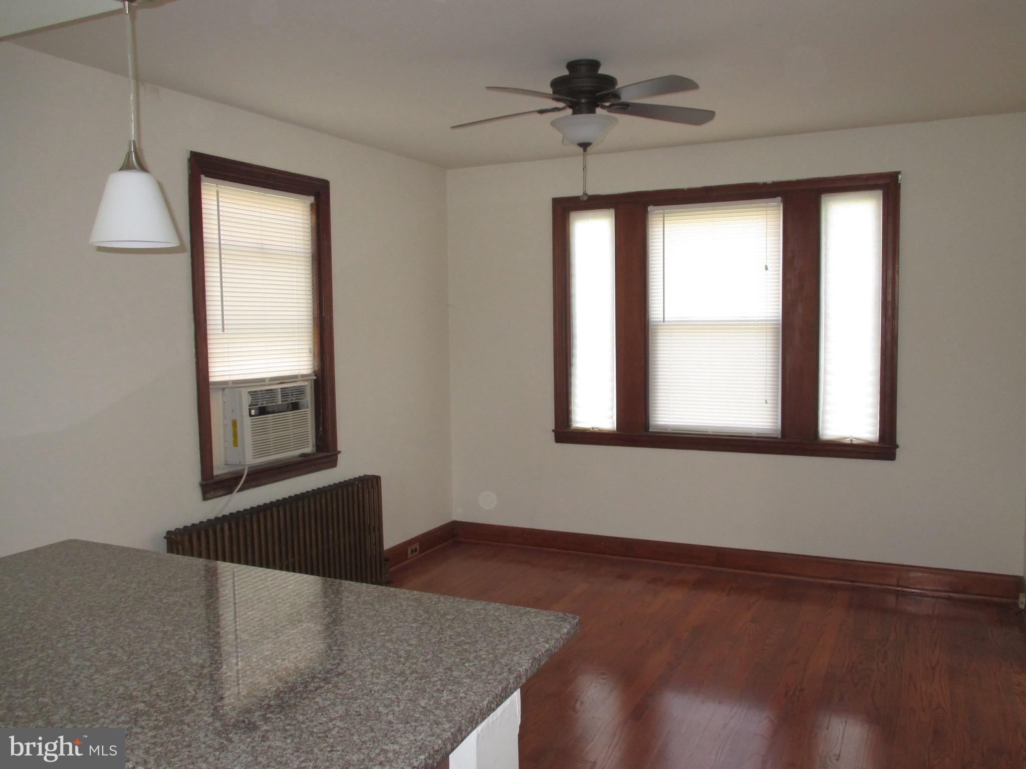 716 Dorchester Road Baltimore, MD 21229 - Photo 4 of 20 a view of an empty room with a window
