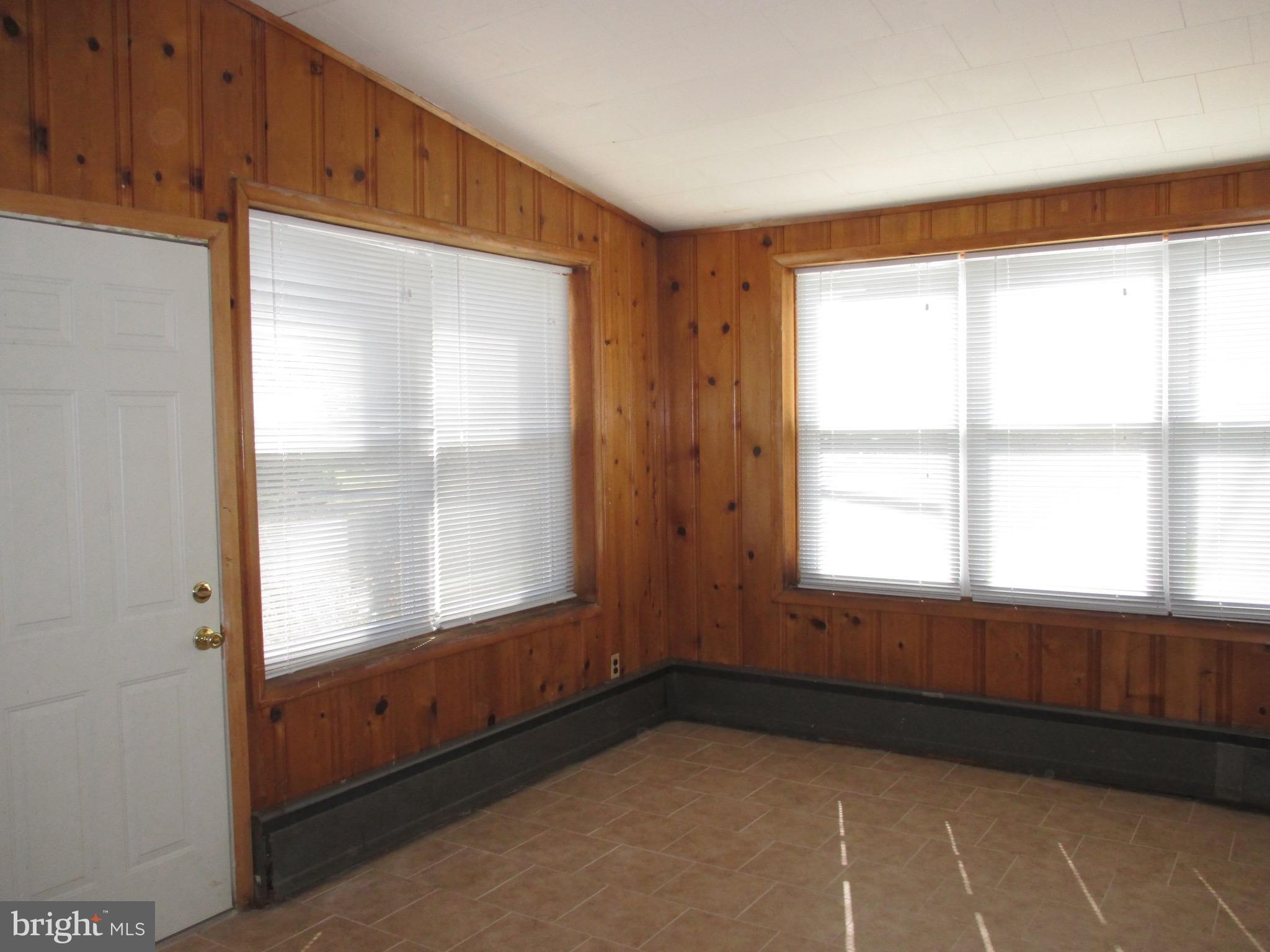 716 Dorchester Road Baltimore, MD 21229 - Photo 5 of 20 a view of an empty room with a window