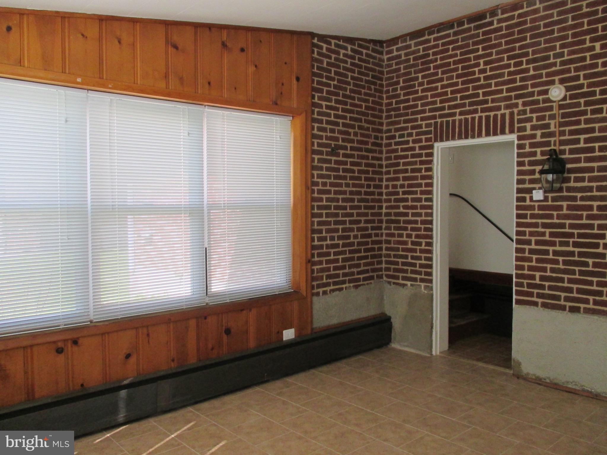 716 Dorchester Road Baltimore, MD 21229 - Photo 8 of 20 a view of an empty room with a window