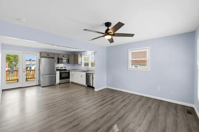 a kitchen with granite countertop a sink and a stove