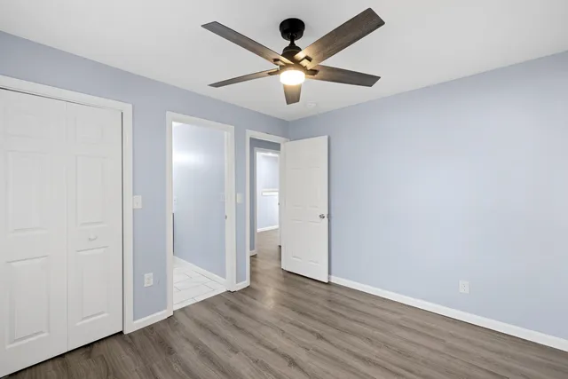 a bathroom with a sink mirror and shower