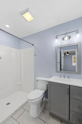 a bathroom with a sink and mirror