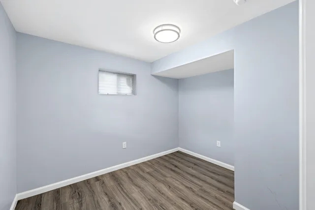 an aerial view of residential houses with yard and trees