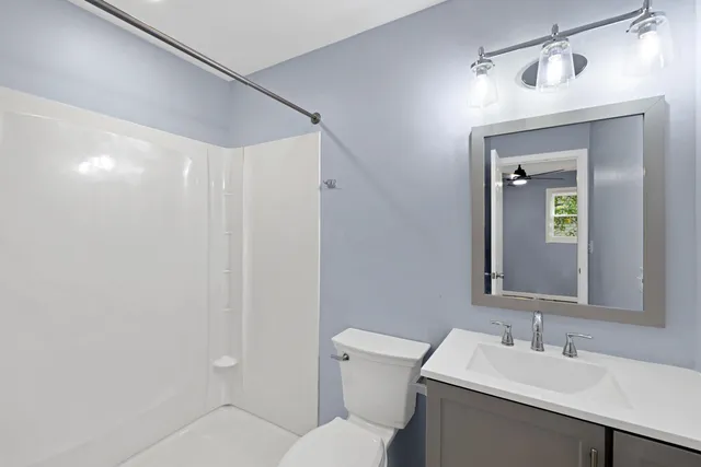 a front view of a house with a yard table and chairs