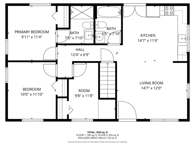 a kitchen with granite countertop stainless steel appliances a center island and a window