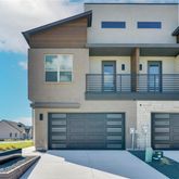 a front view of a house with a garage