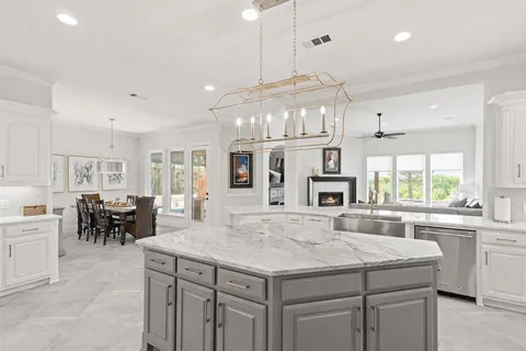 a kitchen with cabinets and window