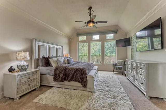 a view of a dining room with furniture wooden floor and chandelier