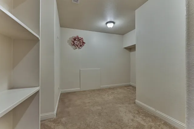 a room with furniture pool table and windows