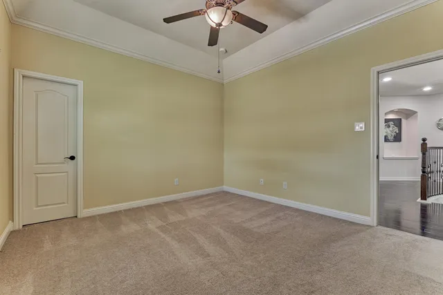 a spacious bedroom with a bed and window