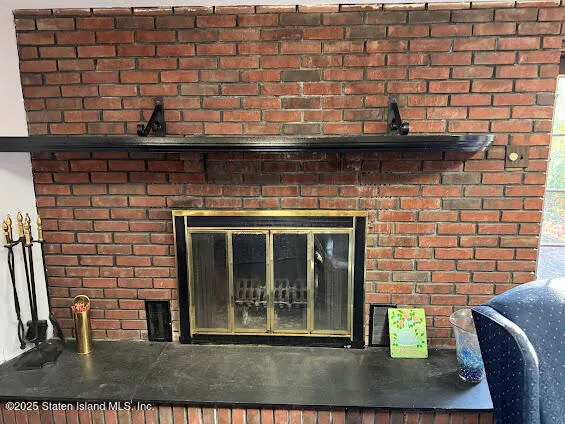 a living room with furniture a dining table and chairs