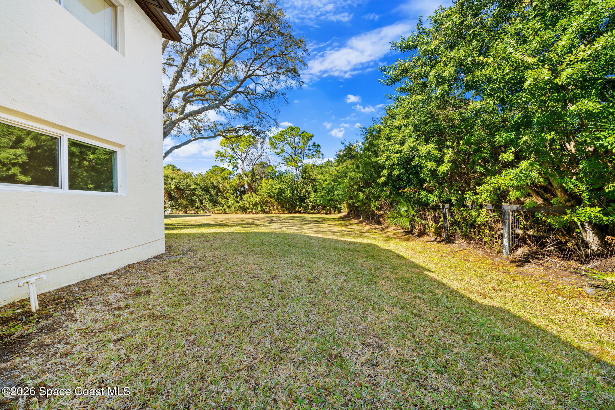 716 Ridge Club Drive Melbourne, FL 32934 - Photo 36 of 40 Green Space behind condo
