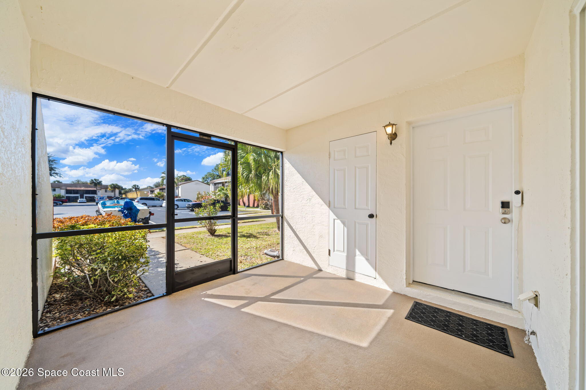 716 Ridge Club Drive Melbourne, FL 32934 - Photo 4 of 40 Screened porch with storage closet