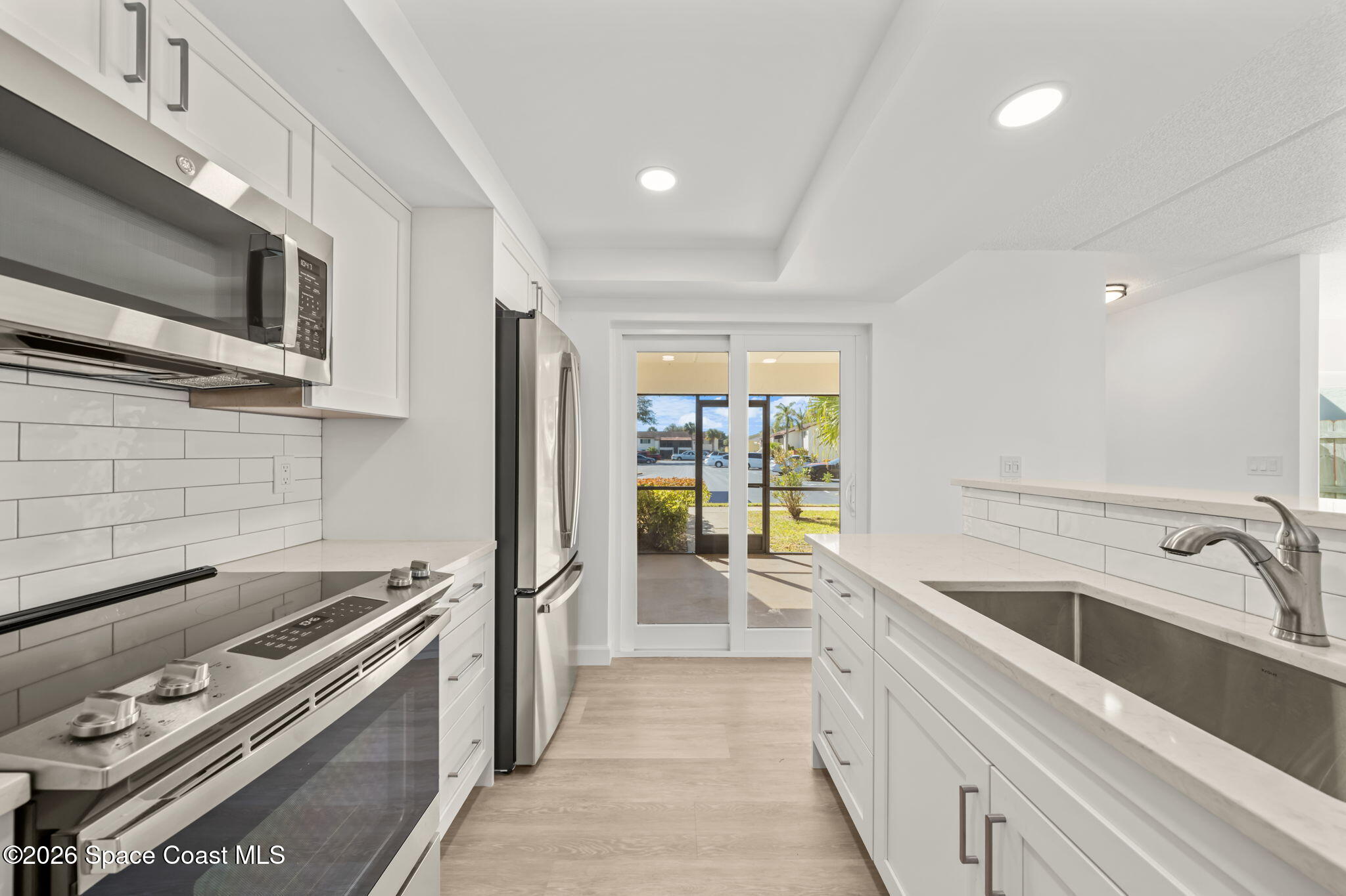 716 Ridge Club Drive Melbourne, FL 32934 - Photo 7 of 40 Kitchen overlooking the front porch
