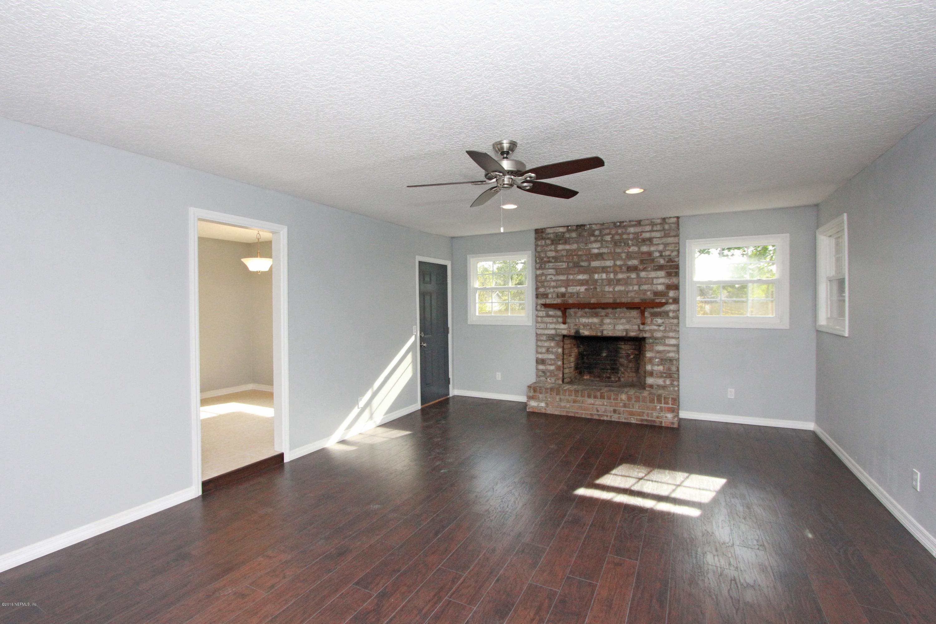 292 Foxridge Road Orange Park, FL 32065 - Photo 10 of 25 LIVING ROOM W. WOOD BURNING FIRE PLACE