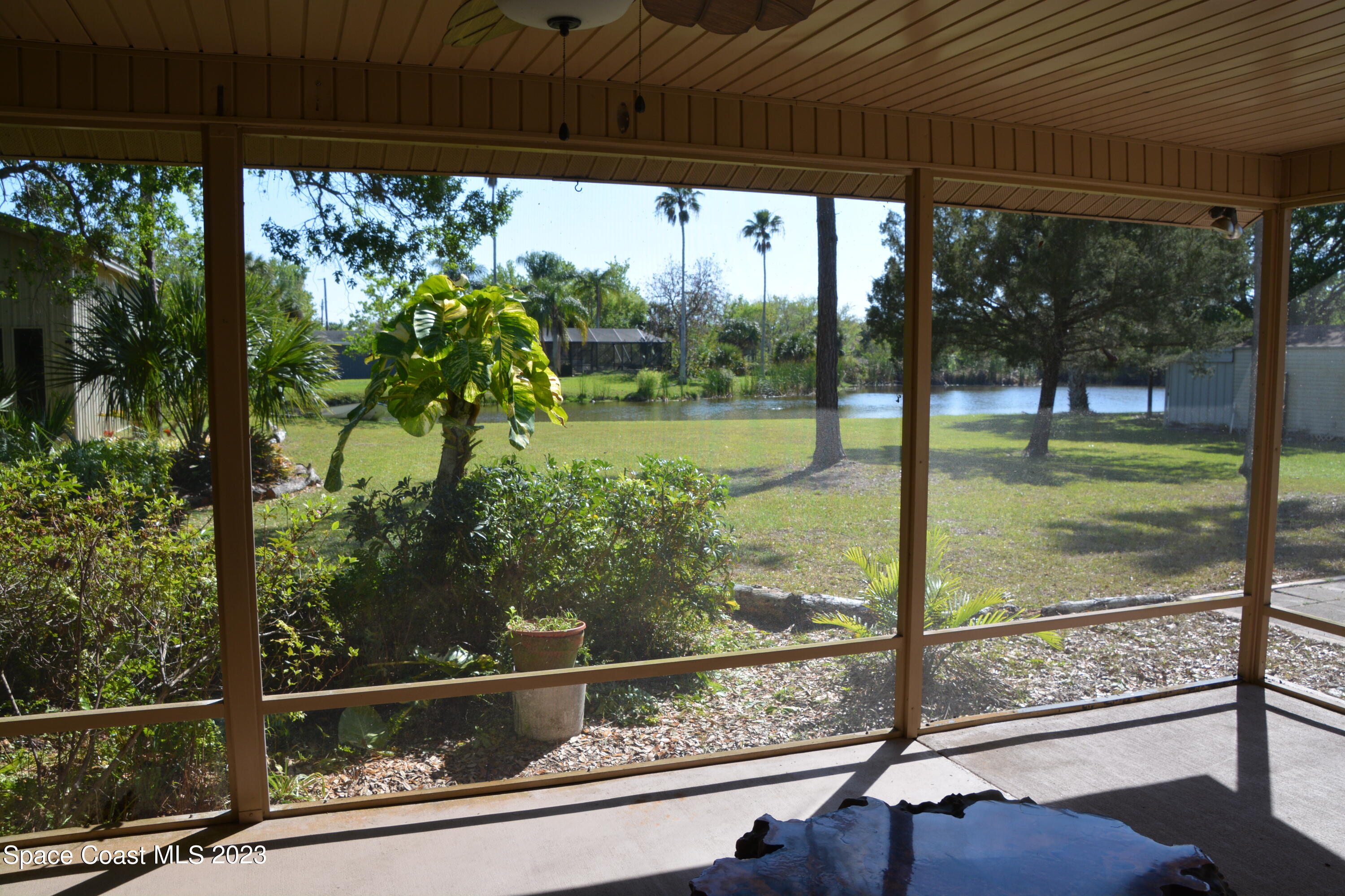 1045 Pine Island Road Merritt Island, FL 32953 - Photo 24 of 42 a view of a porch with a yard