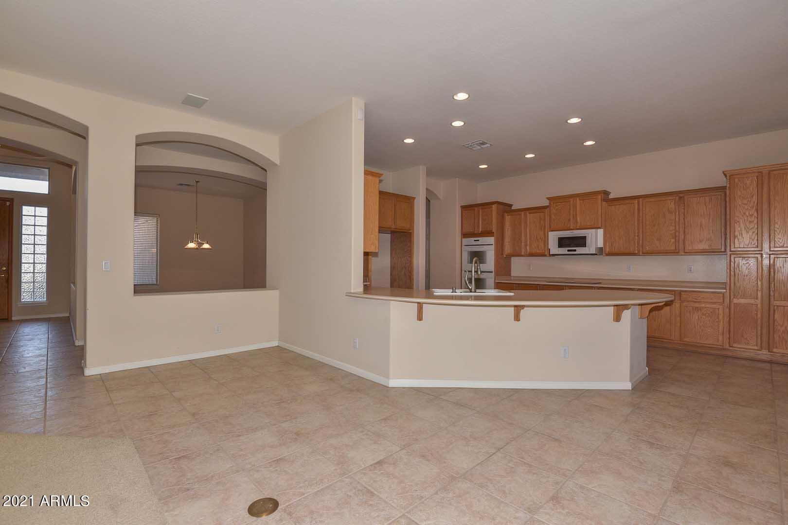 13437 West Coronado Road Goodyear, AZ 85395 - Photo 17 of 52 Family Room-Kitchen2