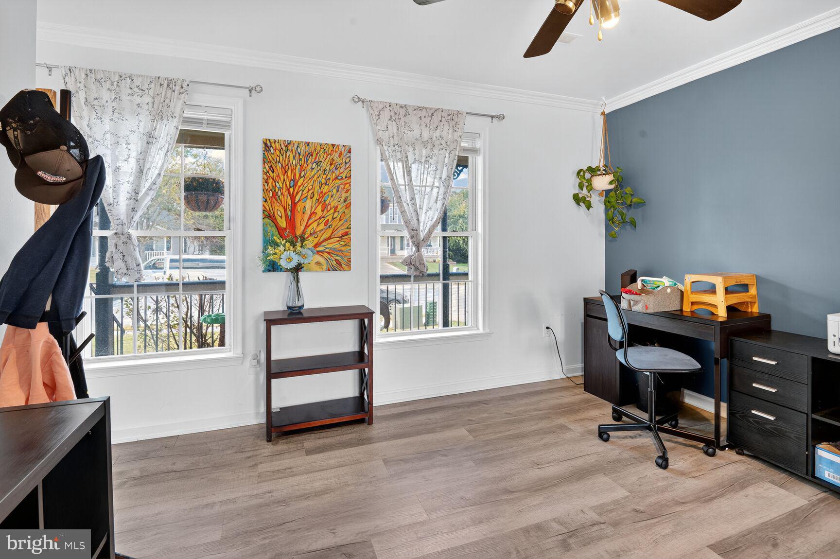 71 Fairground Avenue Taneytown, MD 21787 - Photo 12 of 36 a view of a workspace with furniture and a window