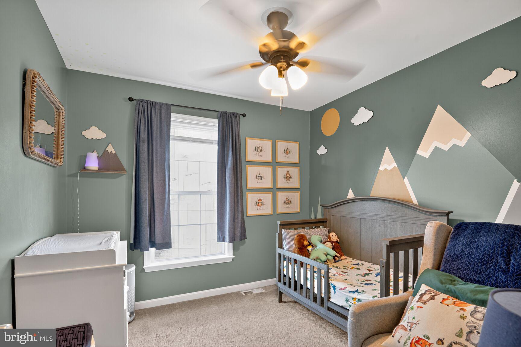 71 Fairground Avenue Taneytown, MD 21787 - Photo 18 of 36 a living room with furniture and a chandelier