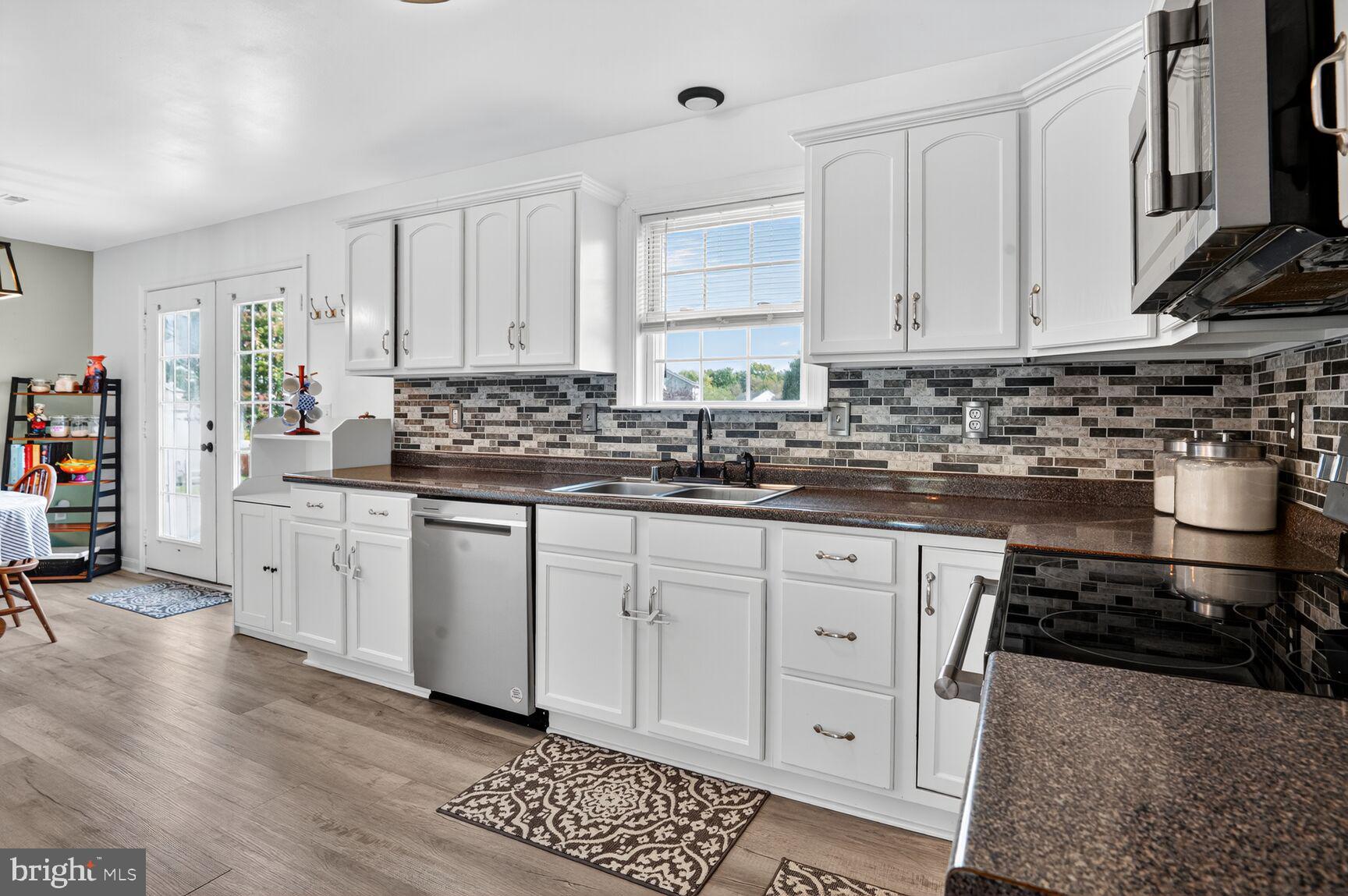 71 Fairground Avenue Taneytown, MD 21787 - Photo 3 of 36 a kitchen with stainless steel appliances a sink stove and cabinets