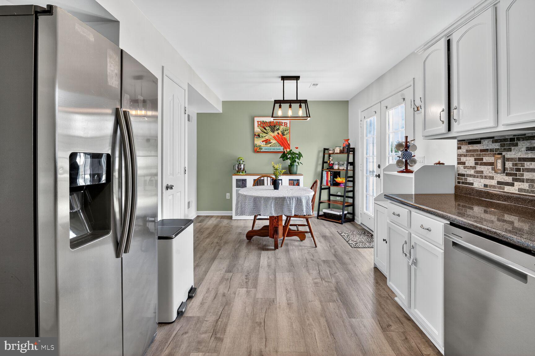 71 Fairground Avenue Taneytown, MD 21787 - Photo 4 of 36 a kitchen with stainless steel appliances granite countertop a refrigerator and microwave