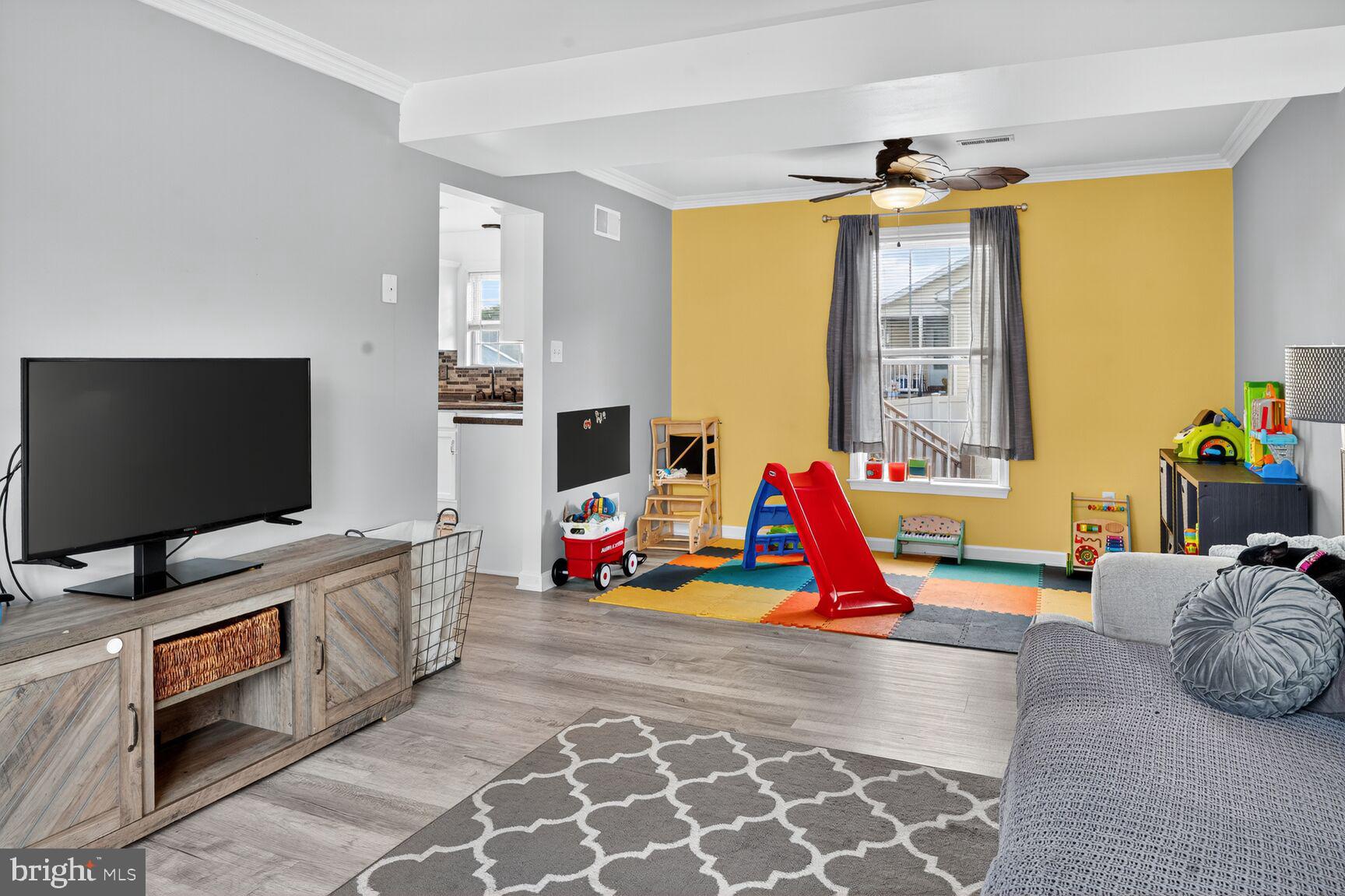 71 Fairground Avenue Taneytown, MD 21787 - Photo 9 of 36 a bedroom with furniture and a flat screen tv