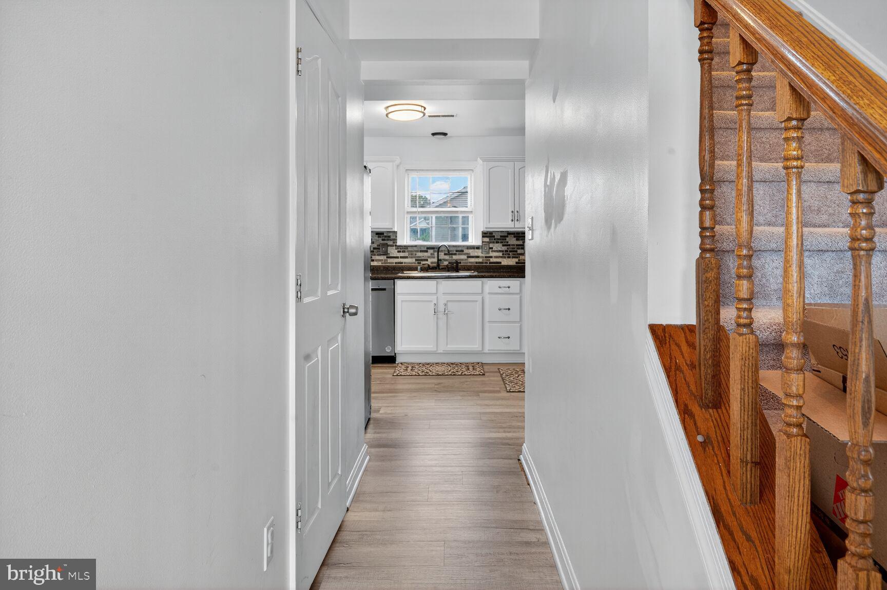 71 Fairground Avenue Taneytown, MD 21787 - Photo 10 of 36 a view of a hallway with wooden floor and staircase