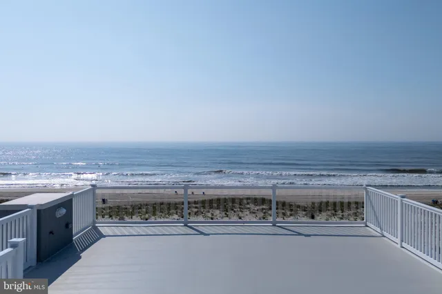 a kitchen with stainless steel appliances granite countertop a sink and a microwave