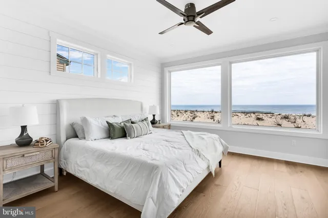 a bathroom with a granite countertop shower a toilet and a sink