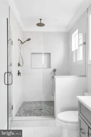 a bathroom with a bathtub and a toilet