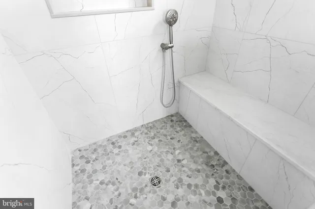 a bathroom with a sink a toilet and bathtub