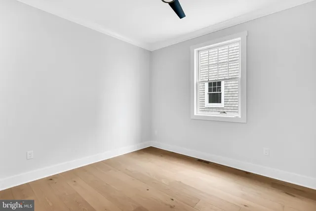 a bathroom with a sink toilet vanity and shower