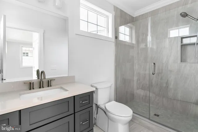 a bathroom with a shower and a toilet