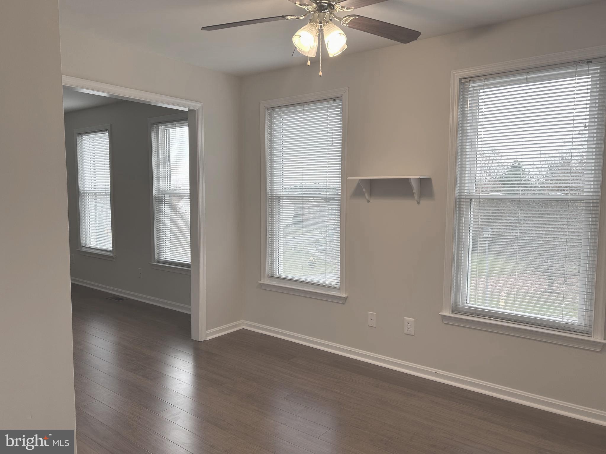33 Hummingbird Lane Newark, DE 19711 - Photo 28 of 53 a view of an empty room with wooden floor and a window