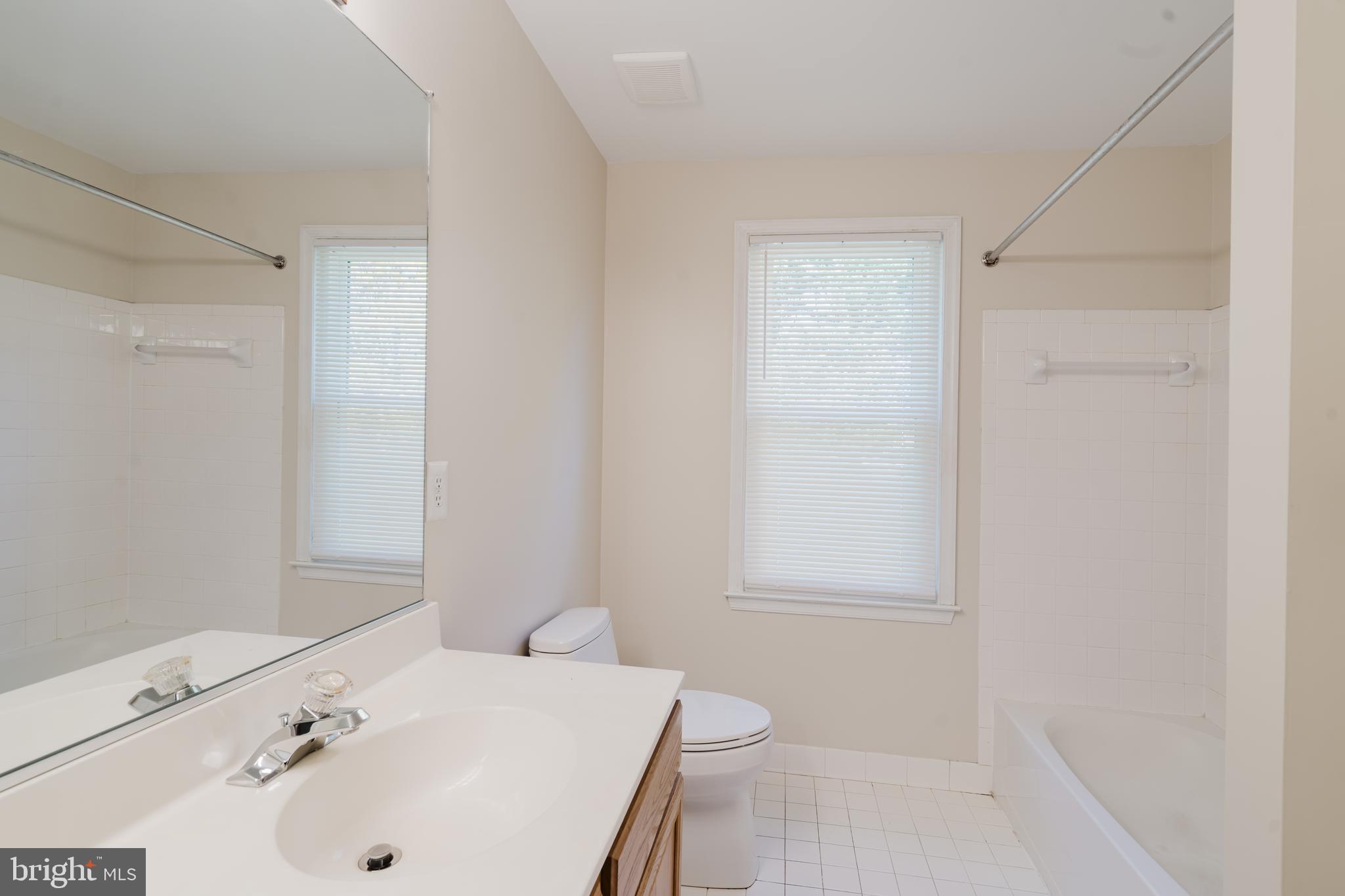 33 Hummingbird Lane Newark, DE 19711 - Photo 32 of 53 a bathroom with a sink a toilet and shower