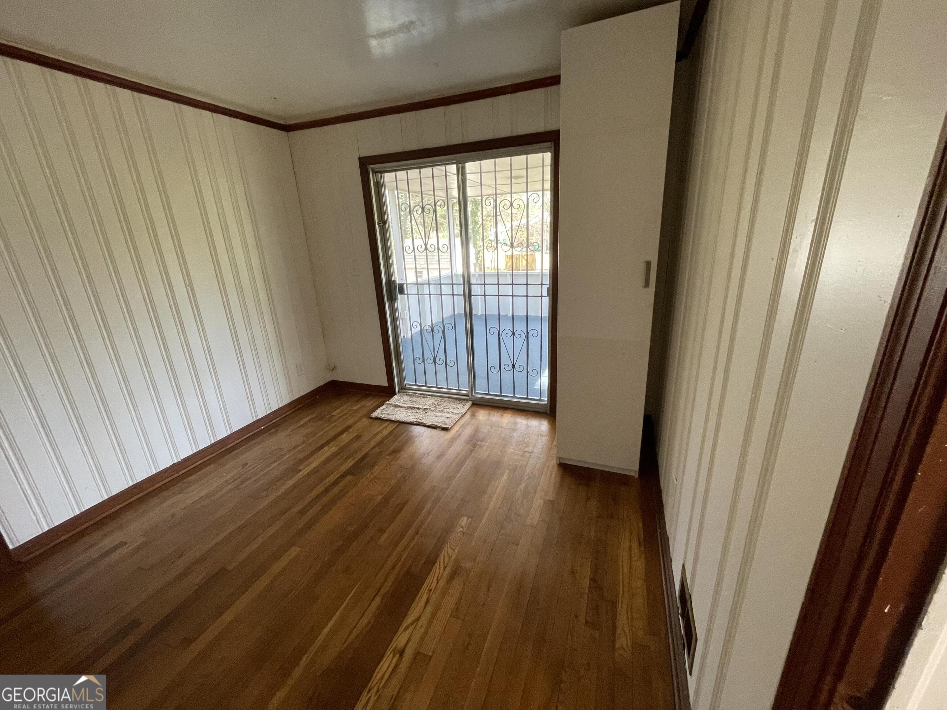 1211 Robinwood Road Decatur, GA 30033 - Photo 5 of 8 a view of a room with wooden floor and door
