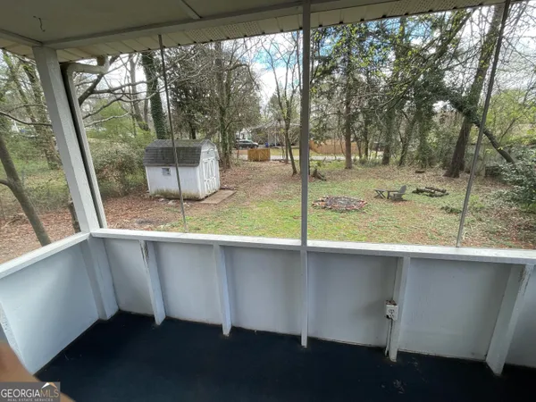 a view of a wooden floor and a window
