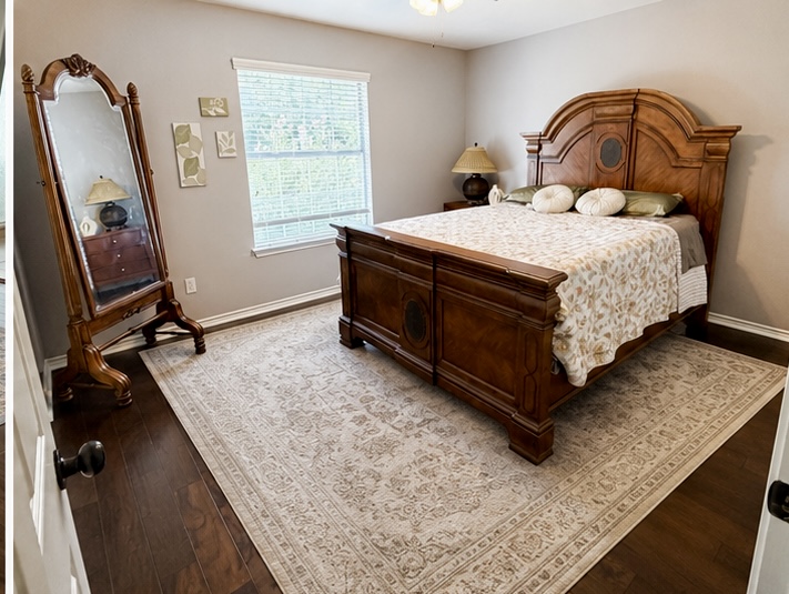 13 Oak View Round Rock, TX 78664 - Photo 17 of 30 Elegant hardwood flooring grounds this well-lit bedroom, featuring ample natural light and a decorative area rug.