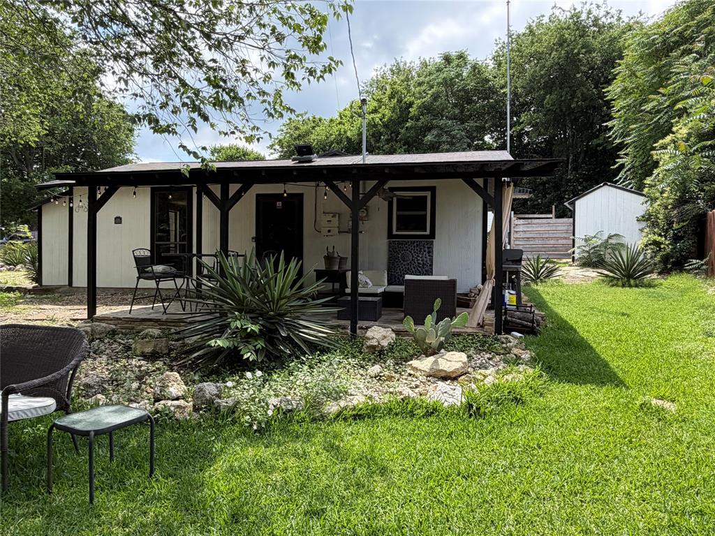 111 Apache Trail Whitney, TX 76692 - Photo 20 of 40 a view of a chair and table in backyard of the house