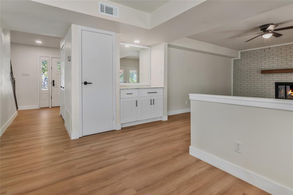 3708 Spring Meadow Lane Flower Mound, TX 75028 - Photo 19 of 39 a view of a kitchen with wooden floor