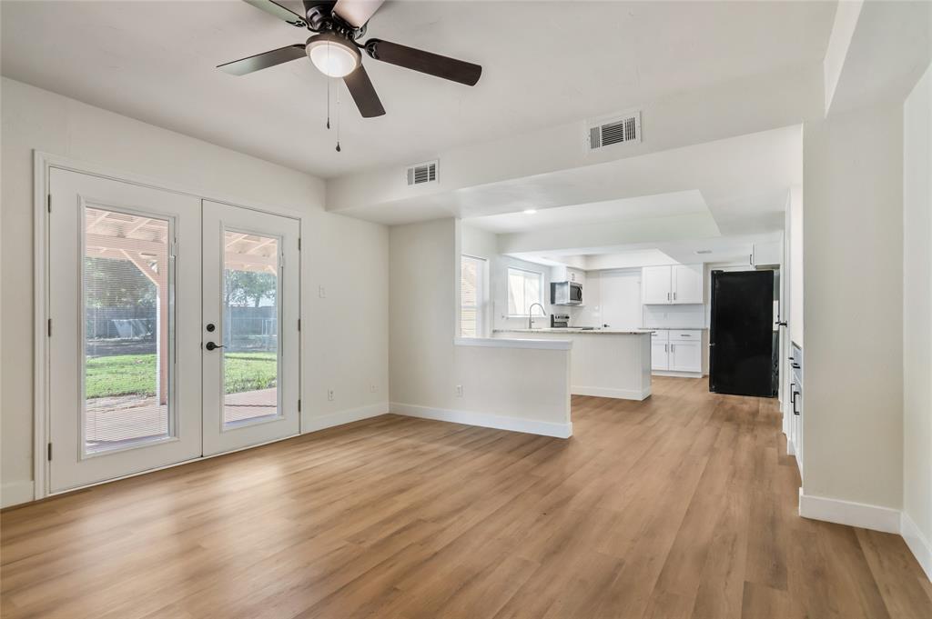 3708 Spring Meadow Lane Flower Mound, TX 75028 - Photo 22 of 39 a view of an empty room with window and wooden floor