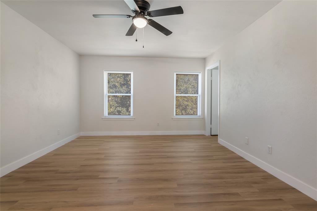 3708 Spring Meadow Lane Flower Mound, TX 75028 - Photo 24 of 39 wooden floor in an empty room with a window