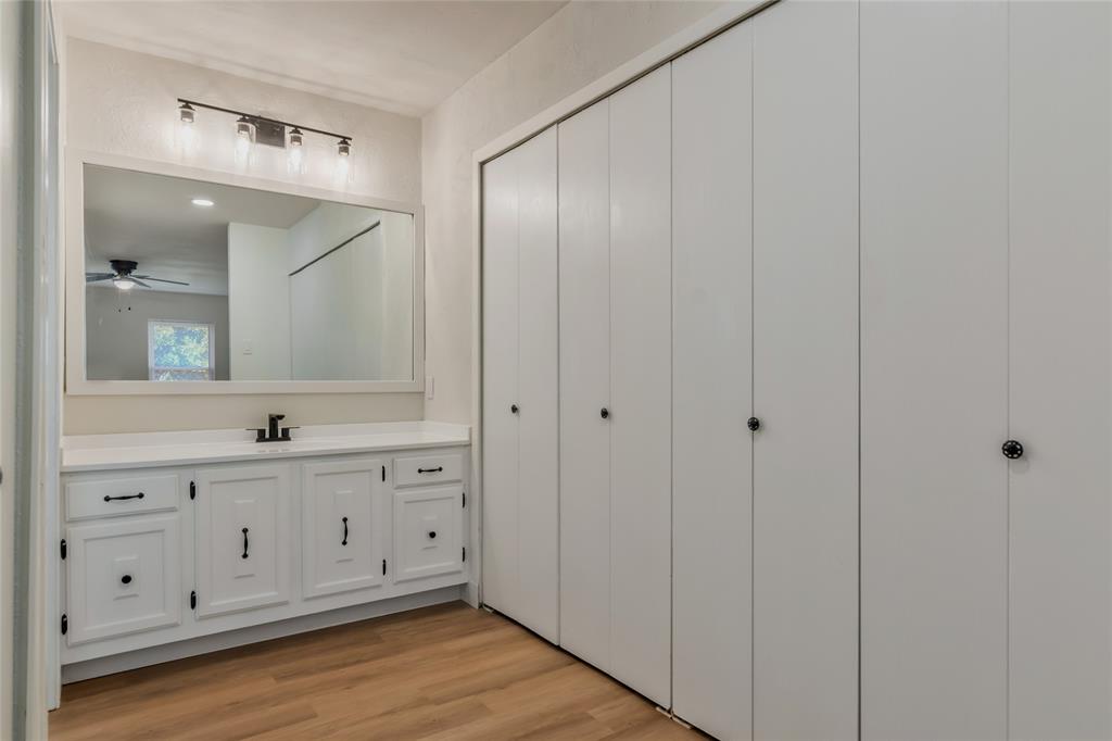 3708 Spring Meadow Lane Flower Mound, TX 75028 - Photo 25 of 39 a bathroom with a double vanity sink and mirror