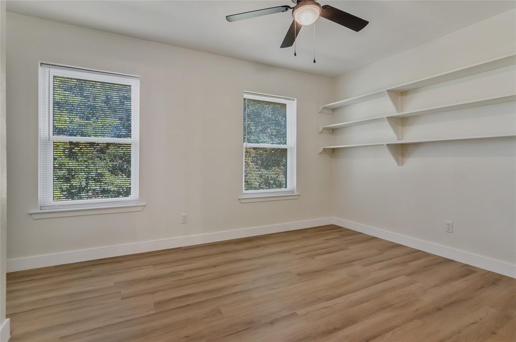 3708 Spring Meadow Lane Flower Mound, TX 75028 - Photo 27 of 39 a view of an empty room with a window and wooden floor