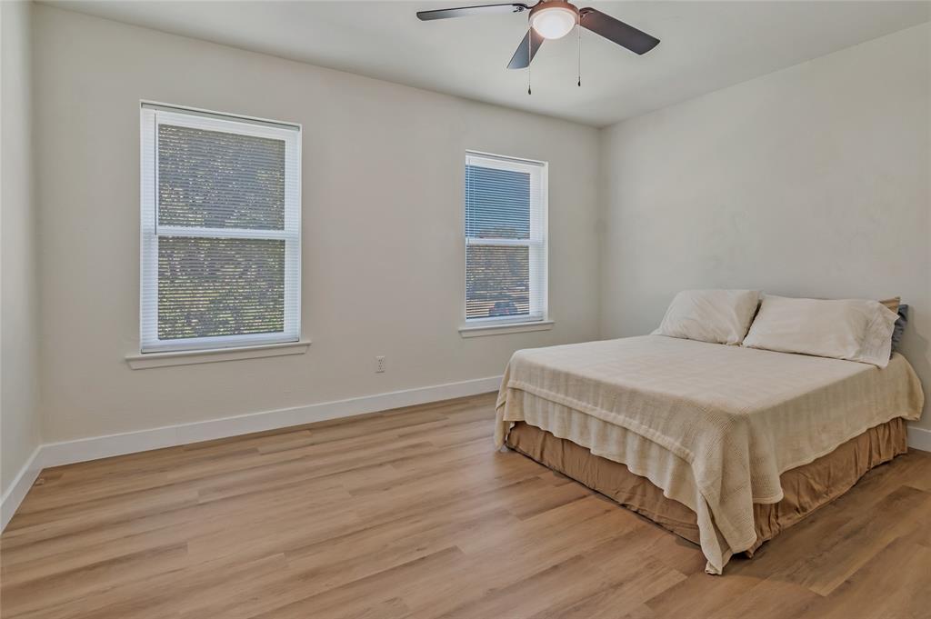 3708 Spring Meadow Lane Flower Mound, TX 75028 - Photo 30 of 39 a spacious bedroom with a bed and a window