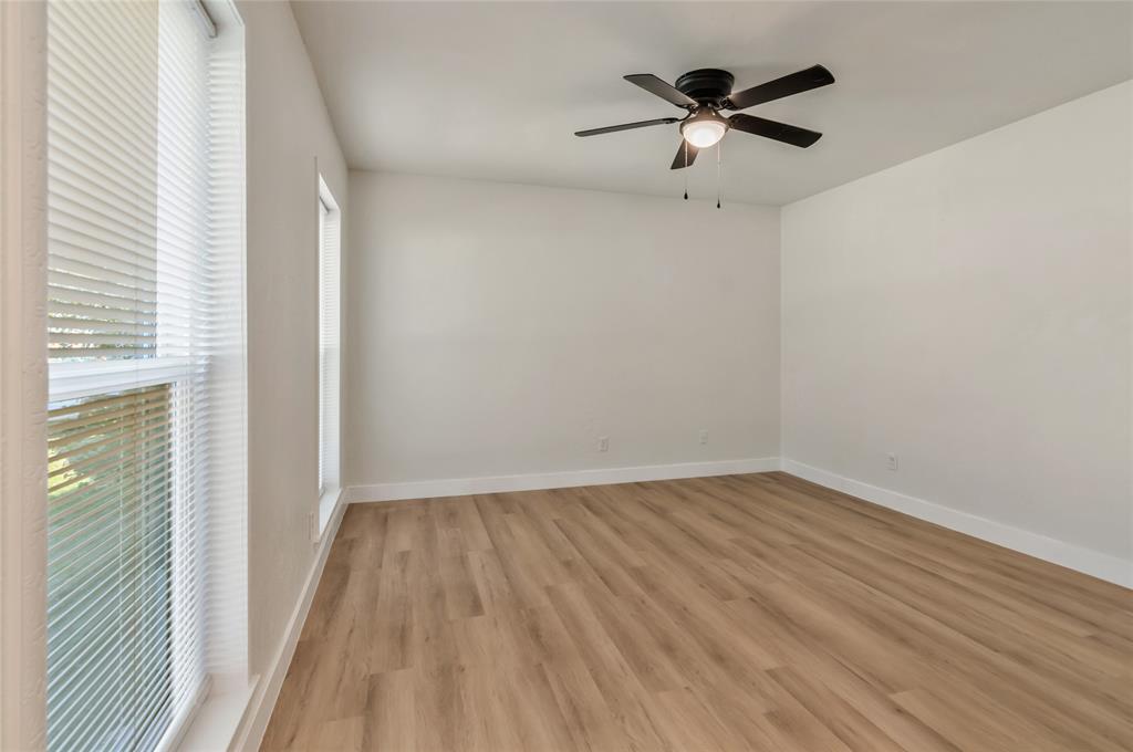 3708 Spring Meadow Lane Flower Mound, TX 75028 - Photo 6 of 39 a view of an empty room with wooden floor