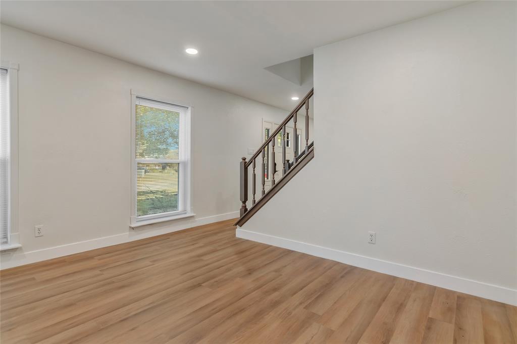 3708 Spring Meadow Lane Flower Mound, TX 75028 - Photo 9 of 39 wooden floor in an empty room with a window